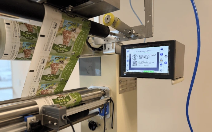 Printed film feeding through automated packaging equipment