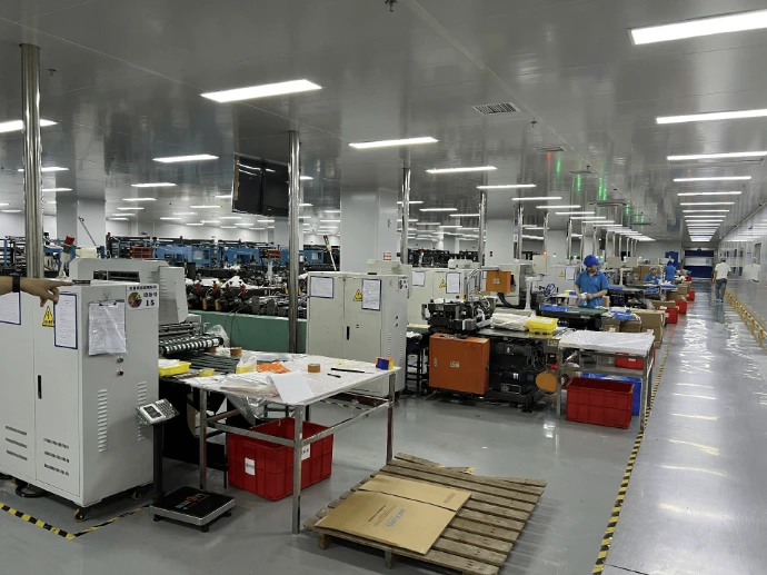Flexible packaging production floor with operators and converting equipment